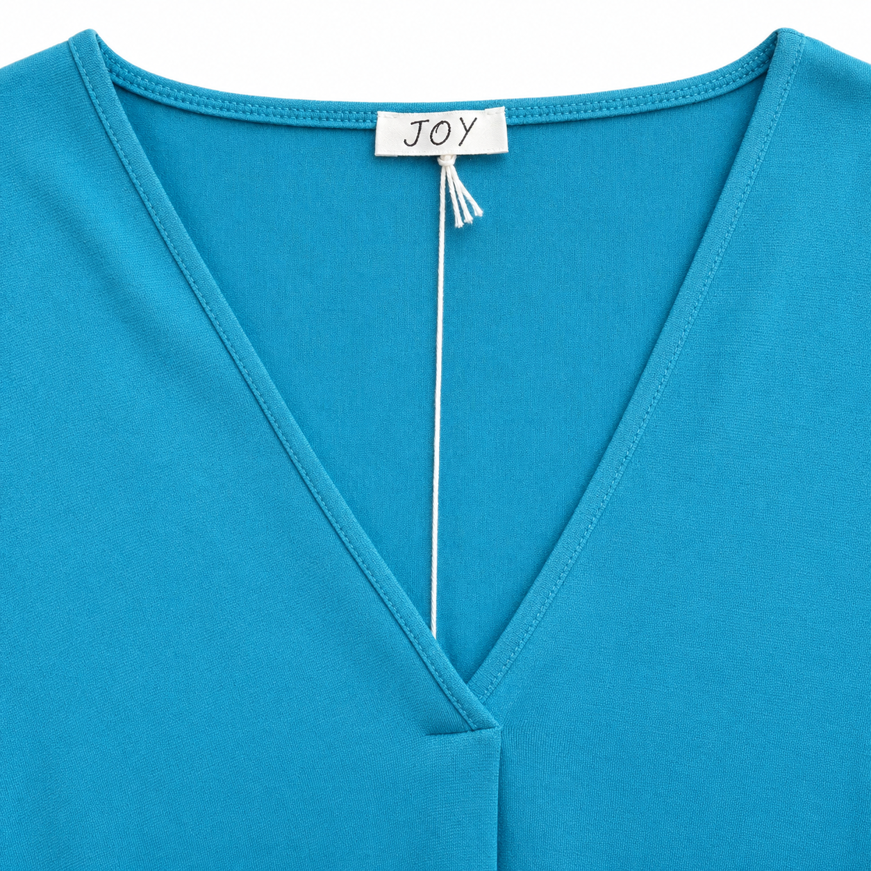 Joy blouse abstracte print - Detail halslijn en label