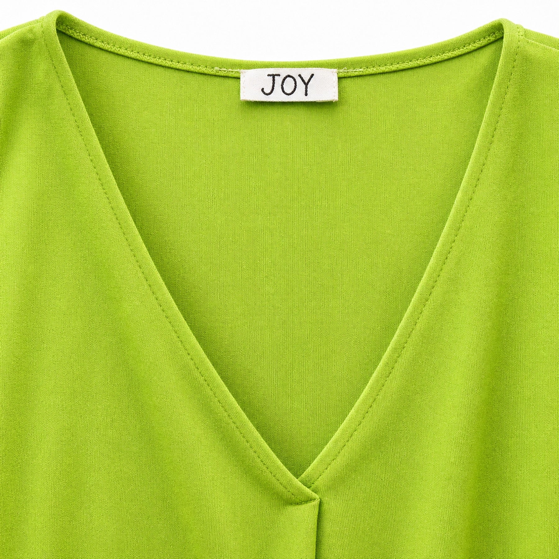 Joy blouse abstracte print - Detail halslijn en label