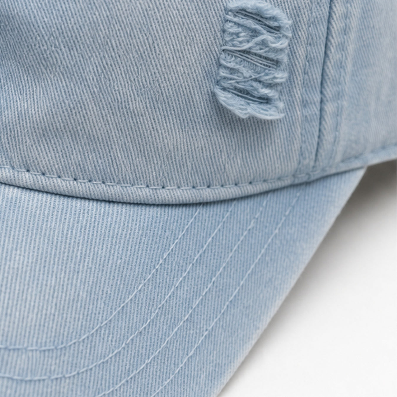 HS petje Lichtblauw Distressed - detail van materiaal en afwerking