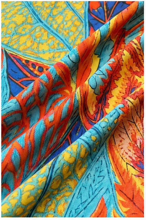 Joy top turquoise/oranje/geel/blauw - Detail stof, print en knopen