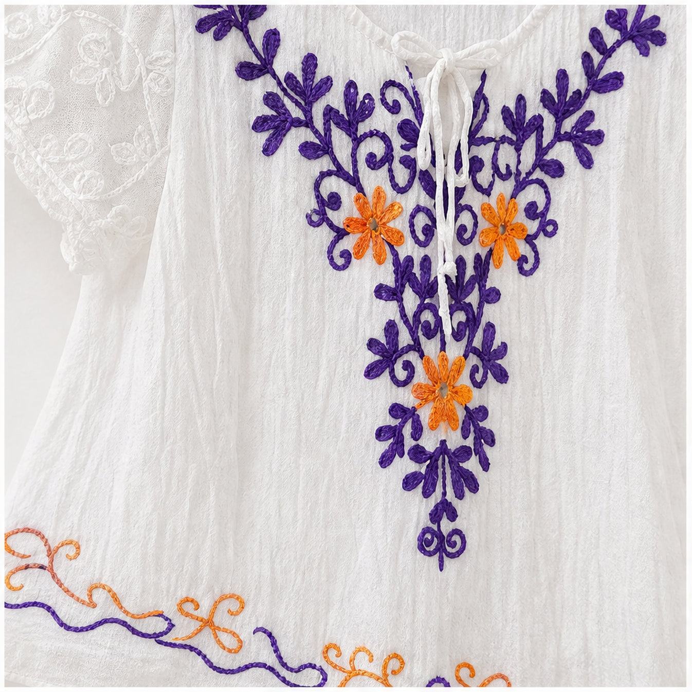 HS Jurk Handmade in India Paars oranje blauw borduur - detail van handwerk en borduursel